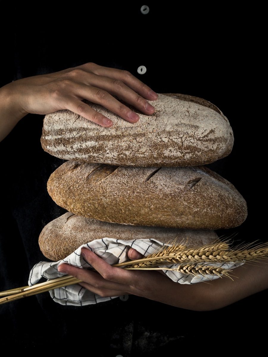 person holding baked bread